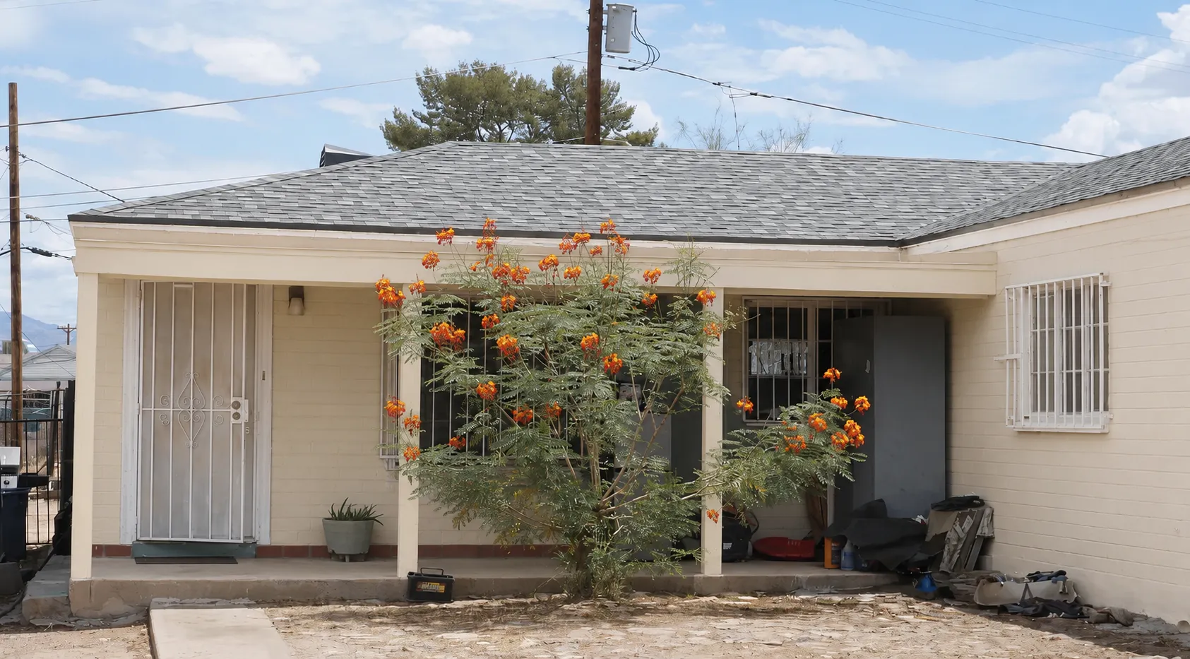 Completed asphalt shingle roof installation on a South Tucson home near Kino Sports Complex with desert landscaping