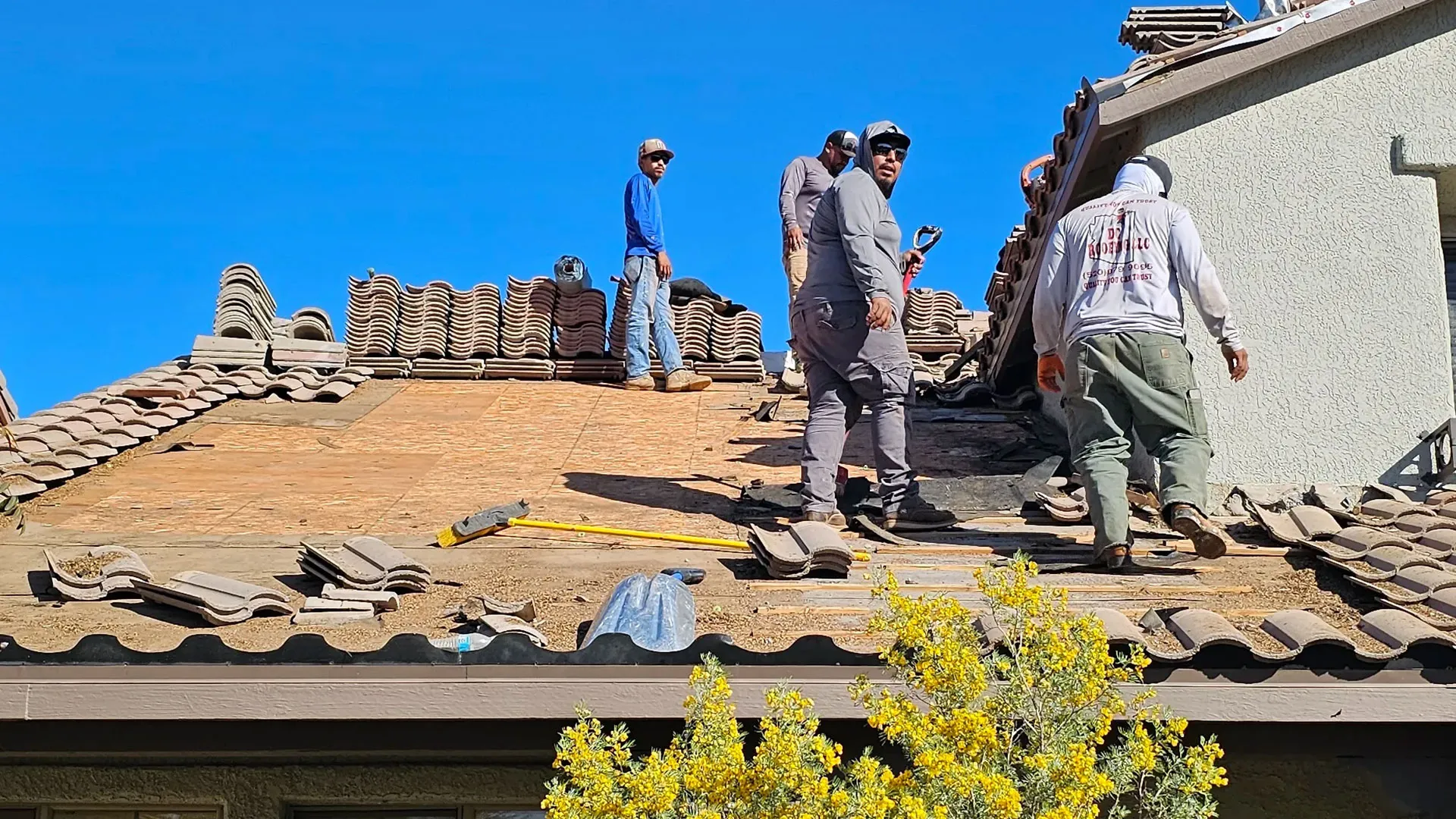 DC Roofing of Arizona crew replacing a tile roof on a Tucson home